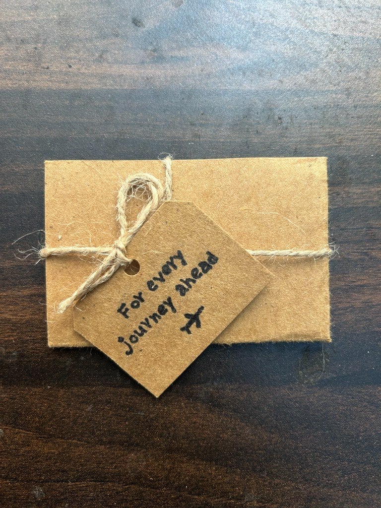 The envelope holding the journey card, tied and waiting.